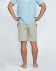The back view of tan shorts with a pocket on the right side.