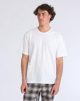 model wearing mens foundation super soft tee in white showing plain white front
