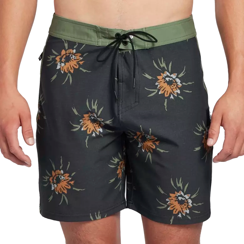 Black boardshorts with green trim and floral pattern front.