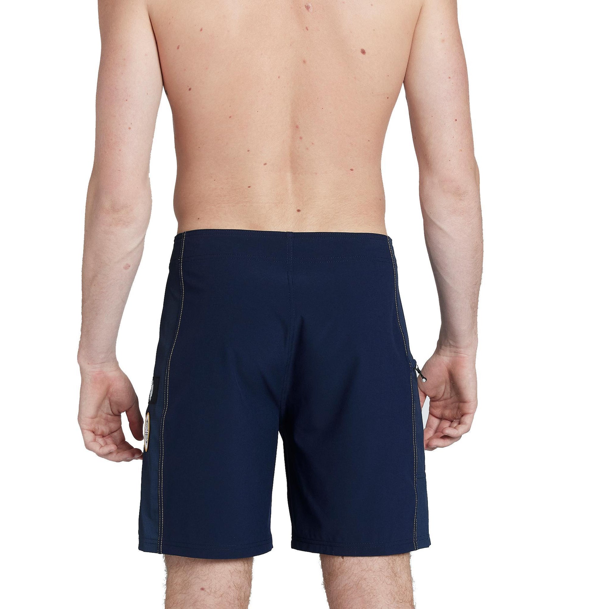 model wearing mens ben carlson 18.5" straight in navy showing back side and yellow accent stitching 