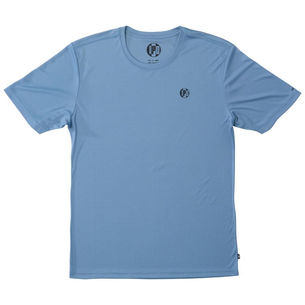 Front view of a light blue polyester water resistant short sleeve Low Key Surf Shirt with a small I P D logo over the heart.