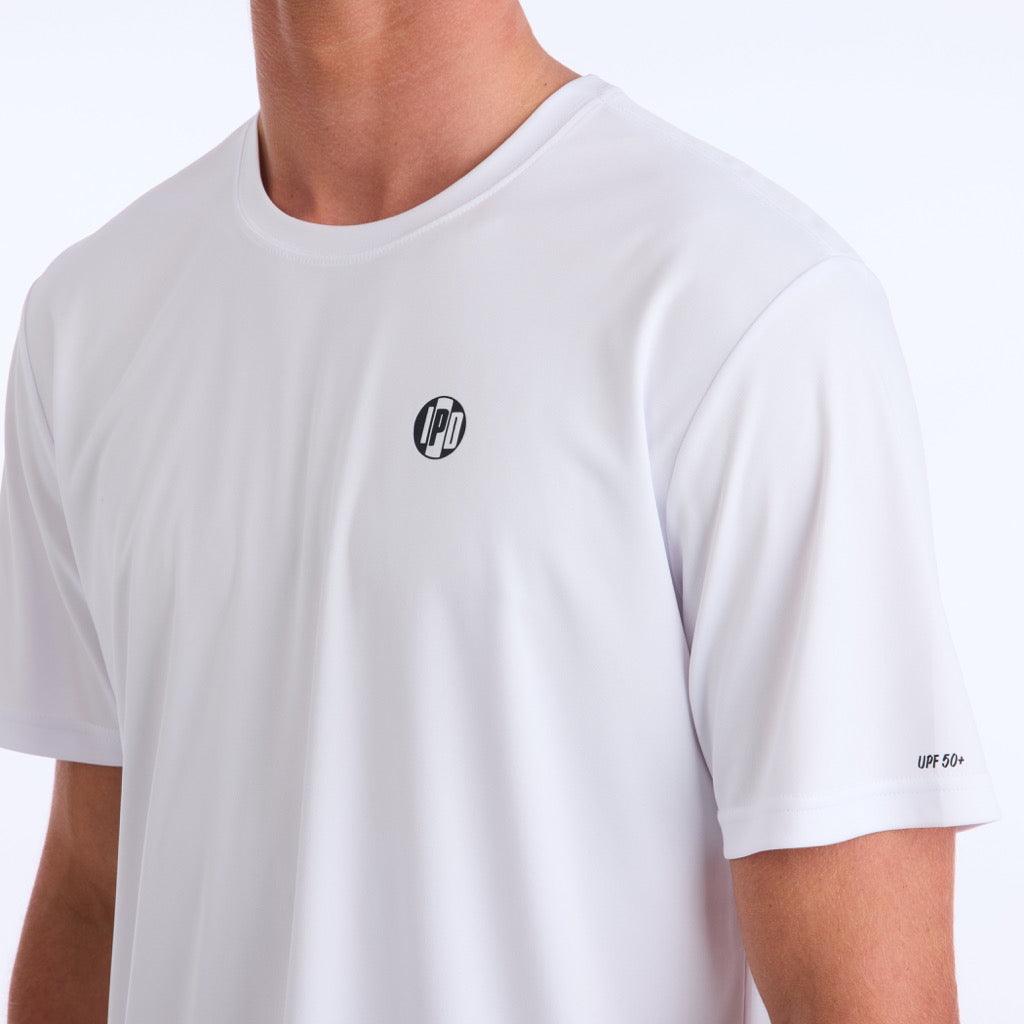 Front side view of a white polyester water resistant short sleeve Low Key Surf Shirt with a small I P D logo over the heart.