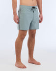 The B100 Chase boardshort features a 16” length and solid sage coloring with a black and white striped side taping. It also has a waistband tie, side zipper pocket, and a black IPD logo patch halfway up the left leg taping.  